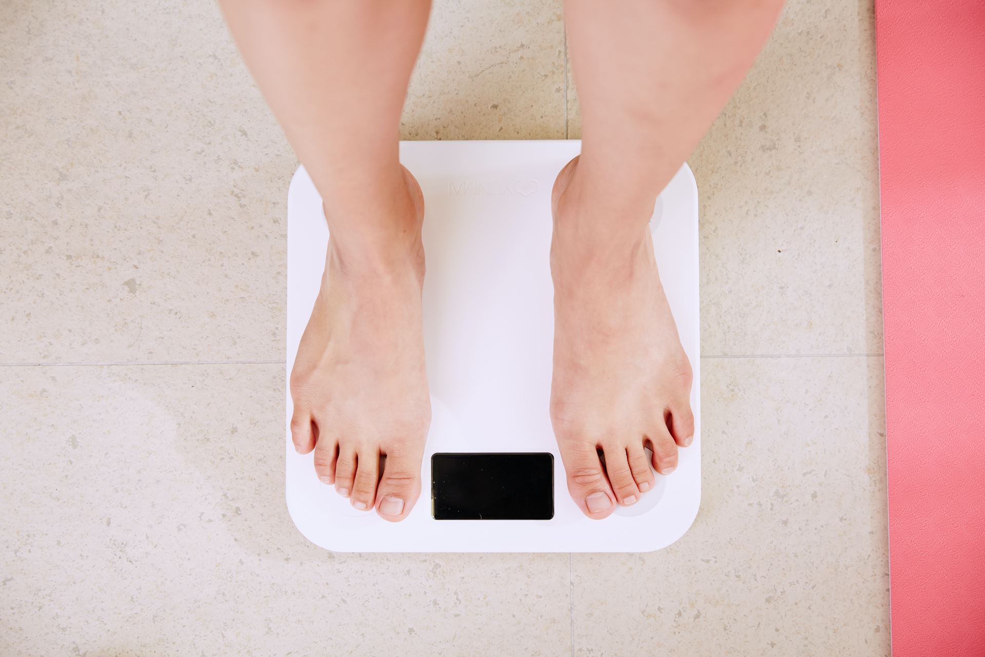 A person standing on scales.